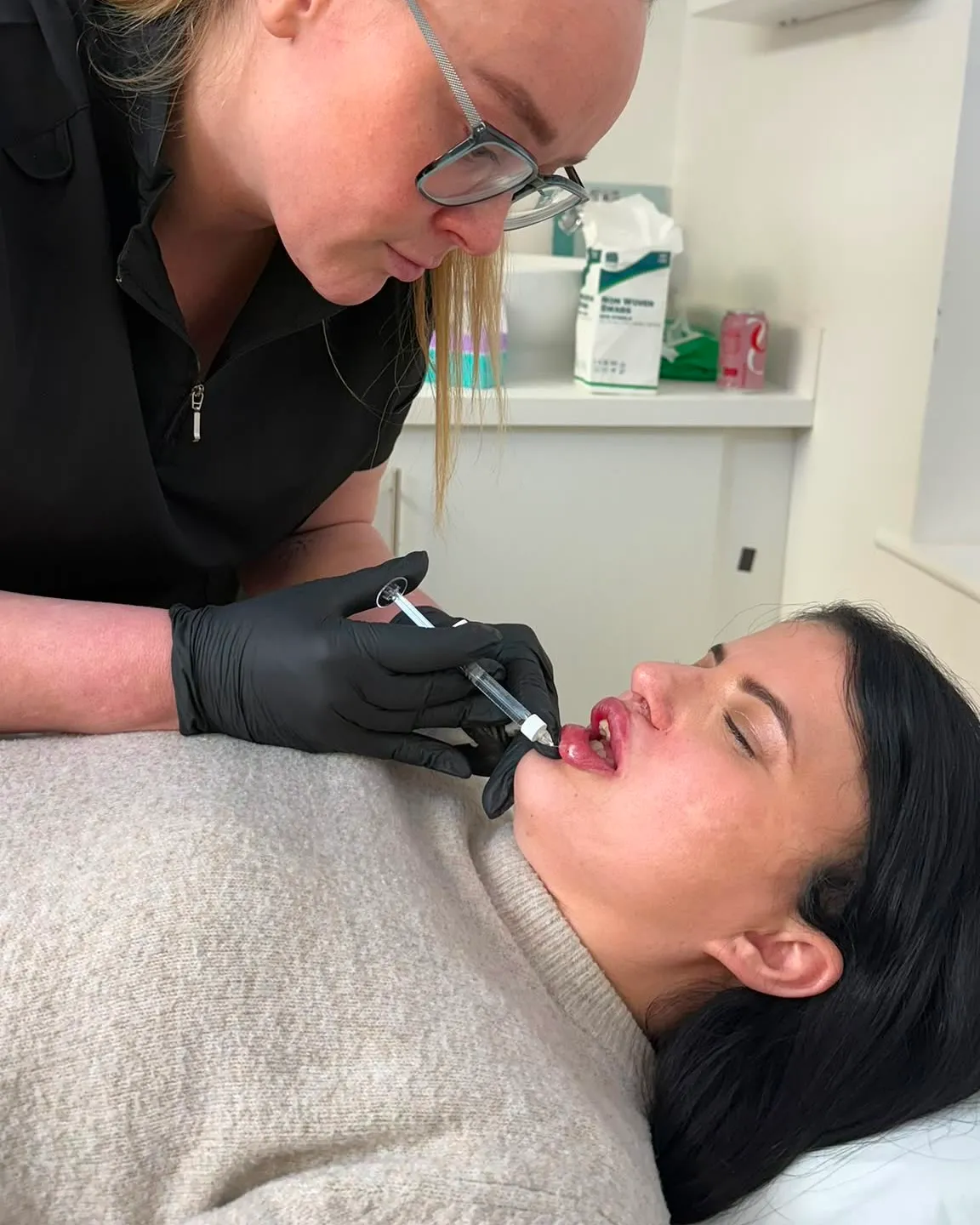 Gemma treating a CleftInject client at the clinic